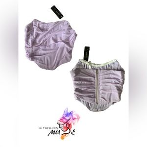 Strapless corset with a gathered mesh overlay